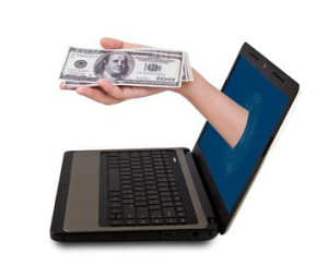 hand-from-laptop-w-money-14943634_s